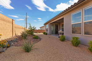 Fenced backyard featuring a patio