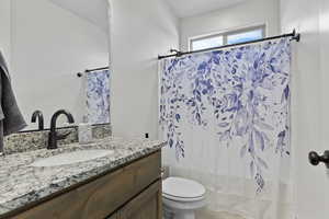 Bathroom with vanity and light tile patterned floors