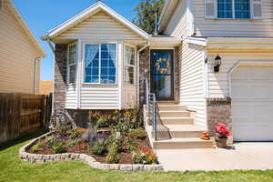 Entrance to property with an attached garage