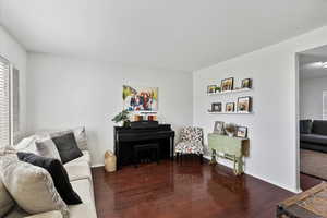Living area with hardwood / wood-style flooring and plenty of natural light