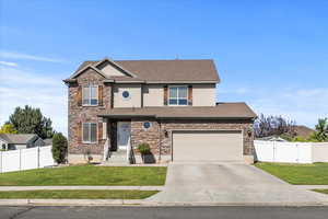 Craftsman house featuring concrete driveway, a shingled roof, stucco siding, a gate, and stone siding
