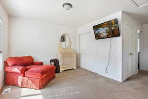 Sitting room with carpet floors