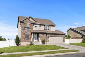 Craftsman-style home with concrete driveway, a garage, stucco siding, stone siding, and a shingled roof