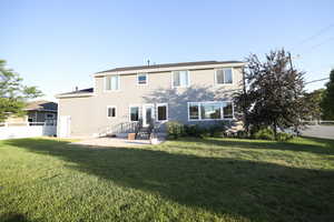 Back of property with a patio