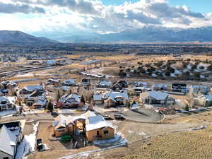 Aerial view of residential area featuring a mountainous background