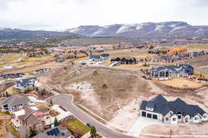 View of property location featuring nearby suburban area and a mountain backdrop