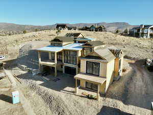View of Back of home with driveway to your motor court