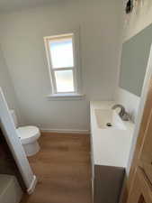 Bathroom with vanity and light wood-style flooring