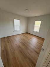 Empty room featuring light wood finished floors and baseboards