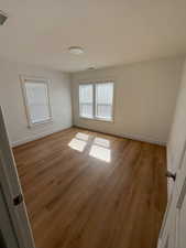 Empty room featuring light wood-style flooring