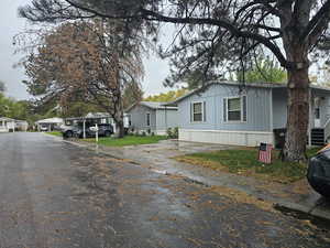 View of side of property featuring driveway