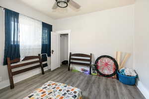 Bedroom featuring wood finished floors and ceiling fan