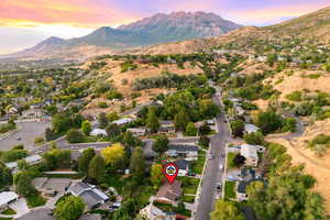 Aerial view at dusk of a residential view and a mountain view