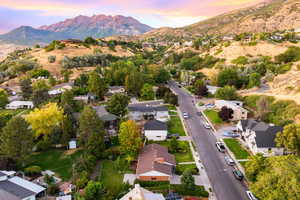 Aerial perspective of suburban area with a mountainous background