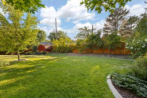 View of yard with an outbuilding