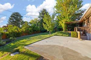 Fenced backyard featuring a patio area