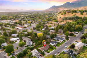 View of property location with mountains and nearby suburban area