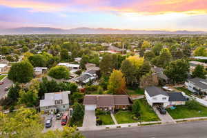 Aerial view at dusk of a residential view and a mountain view