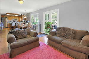 Living room with light wood finished floors and baseboards
