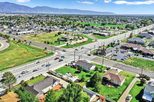 Aerial perspective of suburban area with a mountainous background