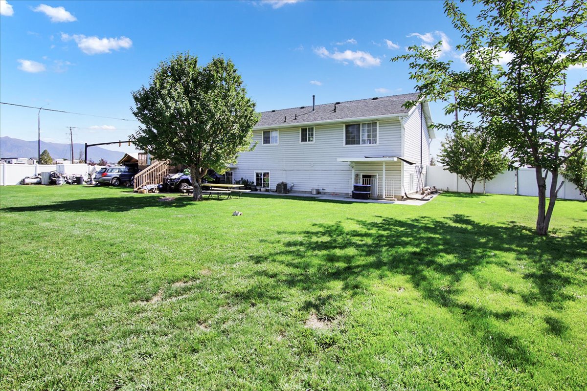 Rear view of house featuring a patio area