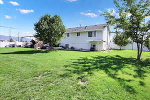 Rear view of house featuring a patio area