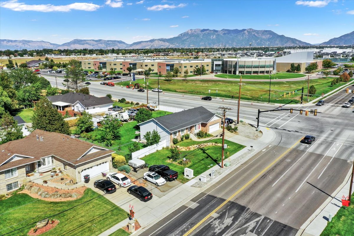 Aerial perspective of suburban area featuring a mountain backdrop