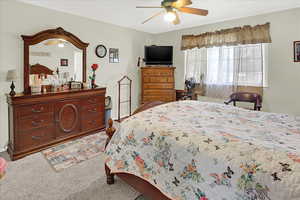 Bedroom with carpet flooring and a ceiling fan