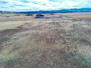 Aerial view of sparsely populated area with a mountain backdrop