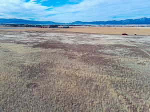 View of mountain backdrop featuring rural landscape