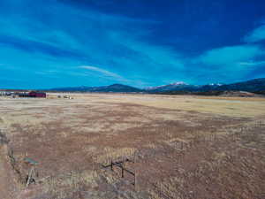 View of yard with a mountain view and a view of rural / pastoral area