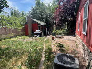 View of yard with an outbuilding