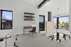 Office area featuring carpet flooring, beam ceiling, and recessed lighting