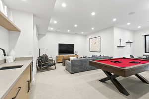 Rec room with light colored carpet, recessed lighting, and billiards table