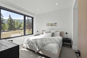 Bedroom featuring carpet, recessed lighting, and a mountain view