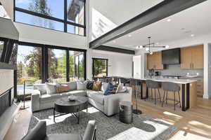 Living area with recessed lighting and light wood finished floors