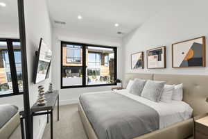 Bedroom with carpet flooring and recessed lighting
