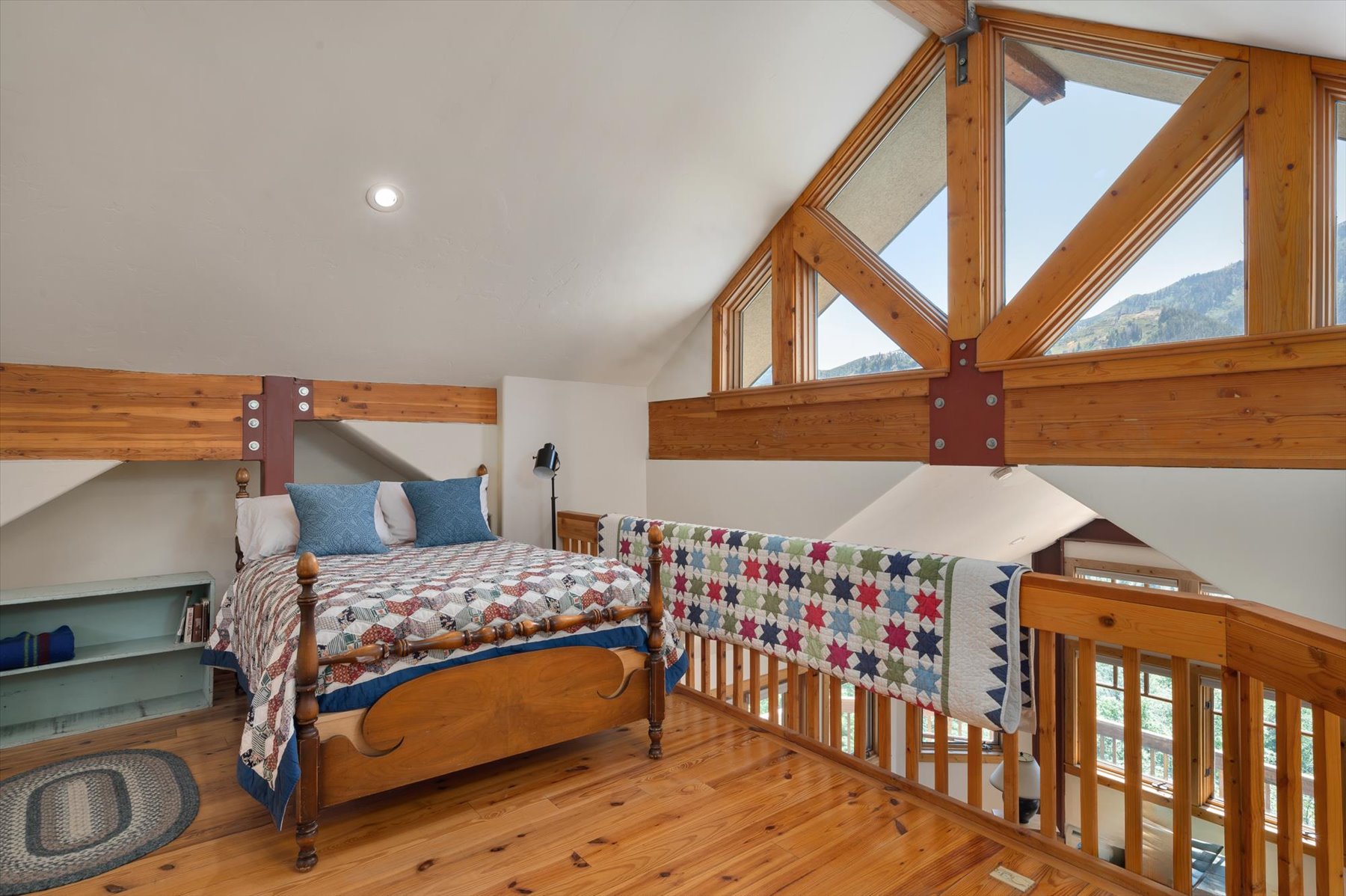 The second floor loft has knotty pine floors and offers wonderful view. This space is currently being used as sleeping space
