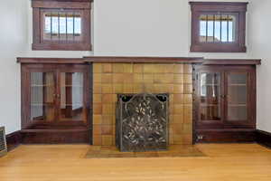Detailed view of a fireplace and wood finished floors
