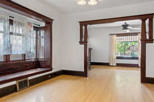 Hall with light wood-type flooring and baseboards