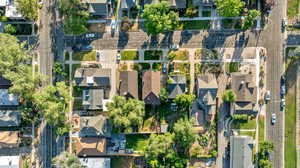Aerial view of property and surrounding area with nearby suburban area