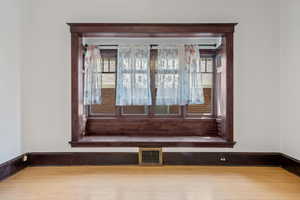 Detailed view of wood finished floors and baseboards