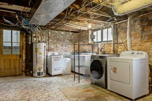 Washroom with gas water heater and washing machine and dryer