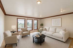 Living room featuring crown molding, light wood-style floors, and recessed lighting
