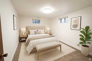 Bedroom featuring carpet flooring and baseboards