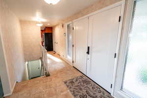 Hallway with an upstairs landing