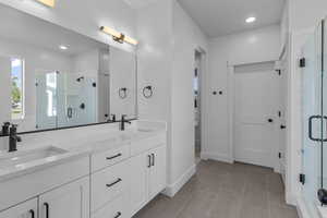 Bathroom featuring a stall shower, light tile patterned floors, and recessed lighting