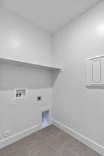 Washroom featuring hookup for a washing machine and electric dryer hookup