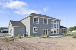 Rear view of property featuring stucco siding and a patio area
