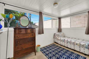 Smaller Bedroom featuring carpet floors, could be office or den